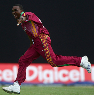 Dwayne Bravo picked up Owais Shah's wicket as England pottered in pursuit of 265